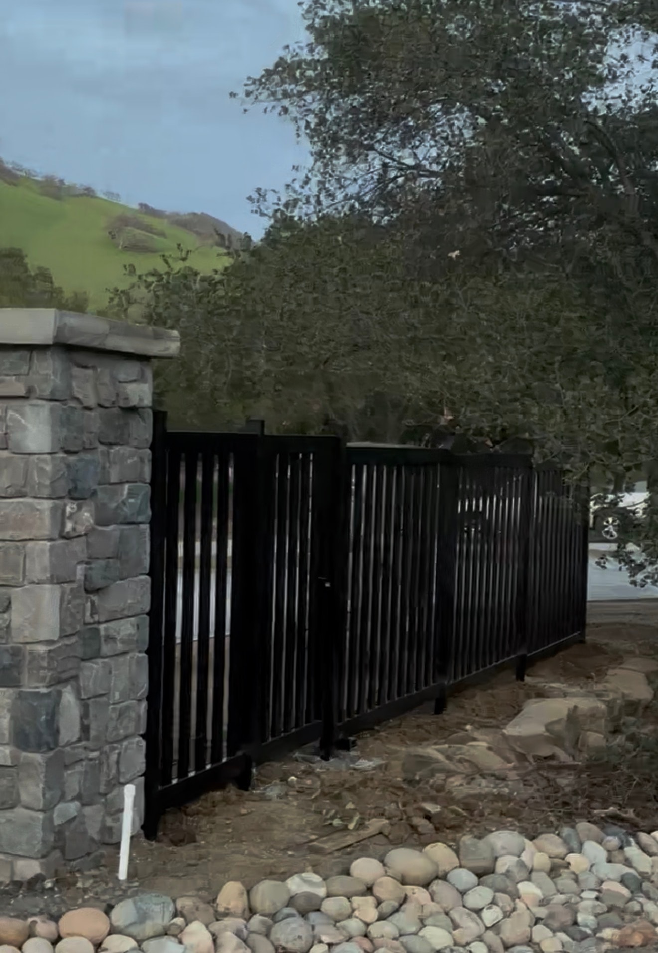 Black Steel Vertical Bar Gate & Stone Pillars